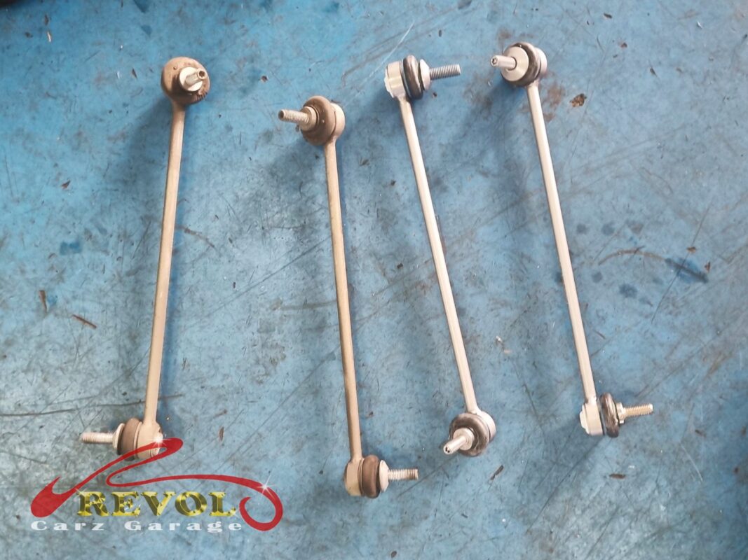 The pair of old drop links (left) beside the new BMW-spec replacements (right).