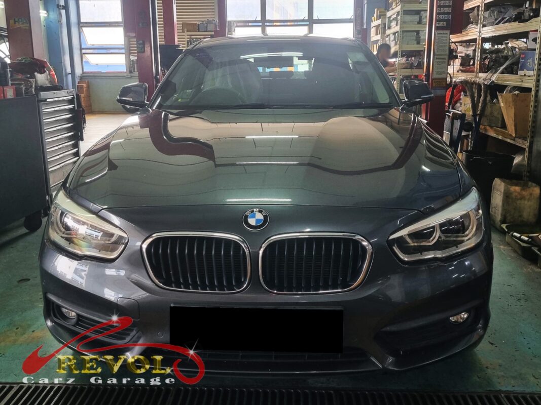 BMW 116d on the workshop lift for rear shock absorber set replacement.
