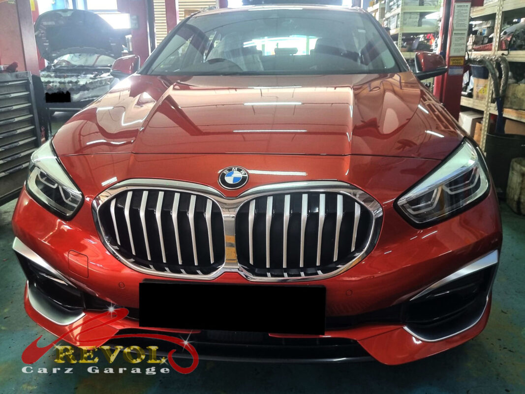 BMW 116i on the workshop lift for routine scheduled servicing.