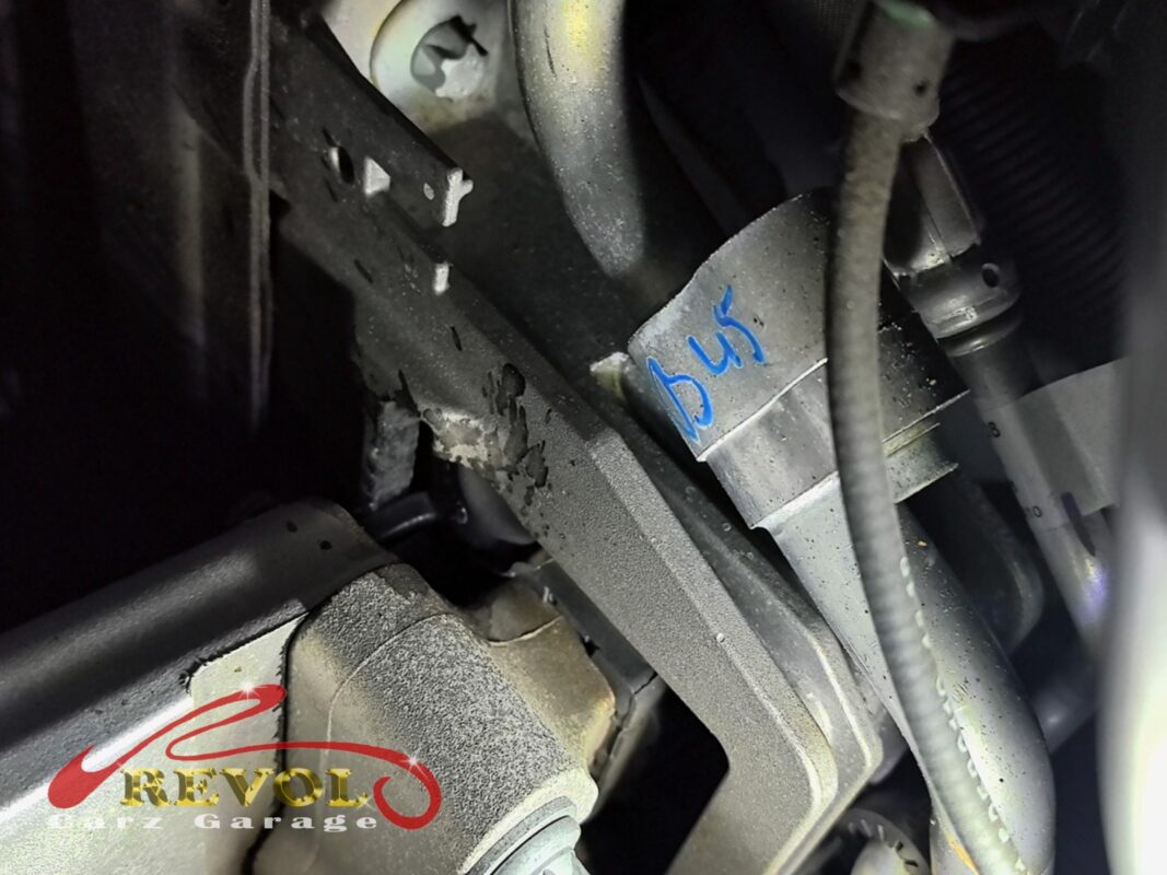 The engine mount area in the bay, the bracket corroded and the old rubber breaking down.