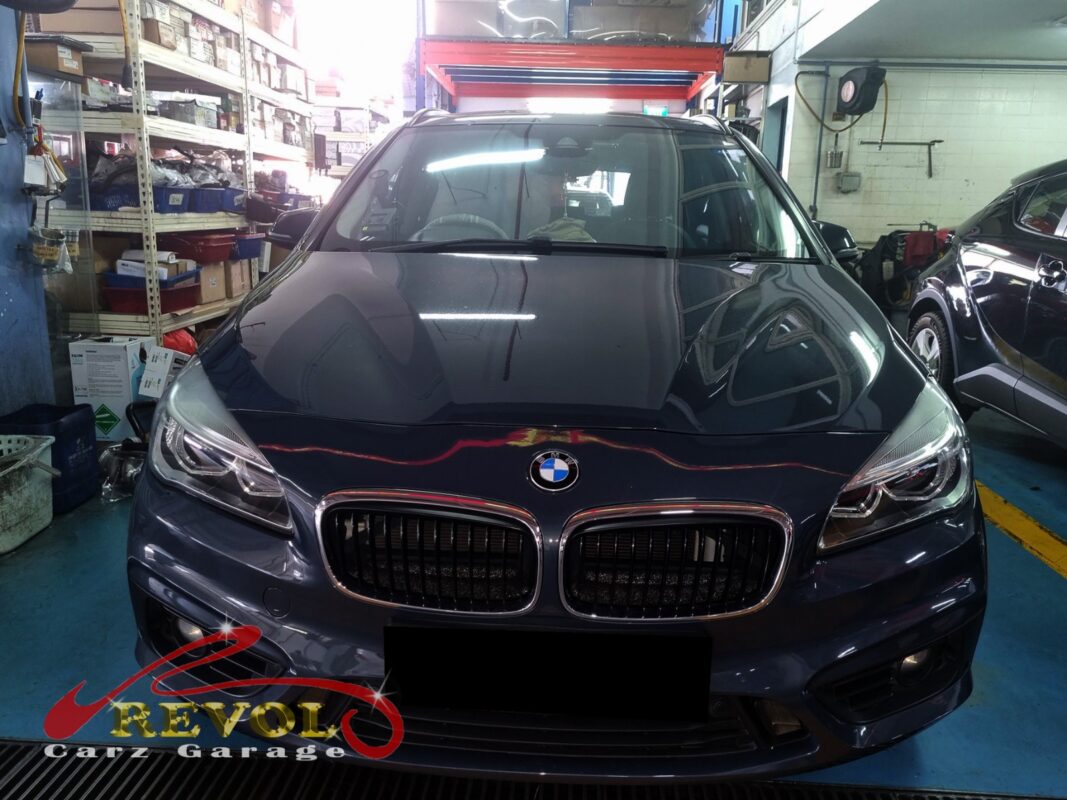 BMW 216d on the workshop lift for water pump replacement.
