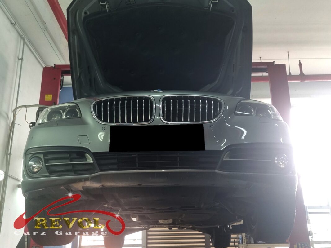 The 528i up on the two-post lift, in for the engine and gearbox mounts.