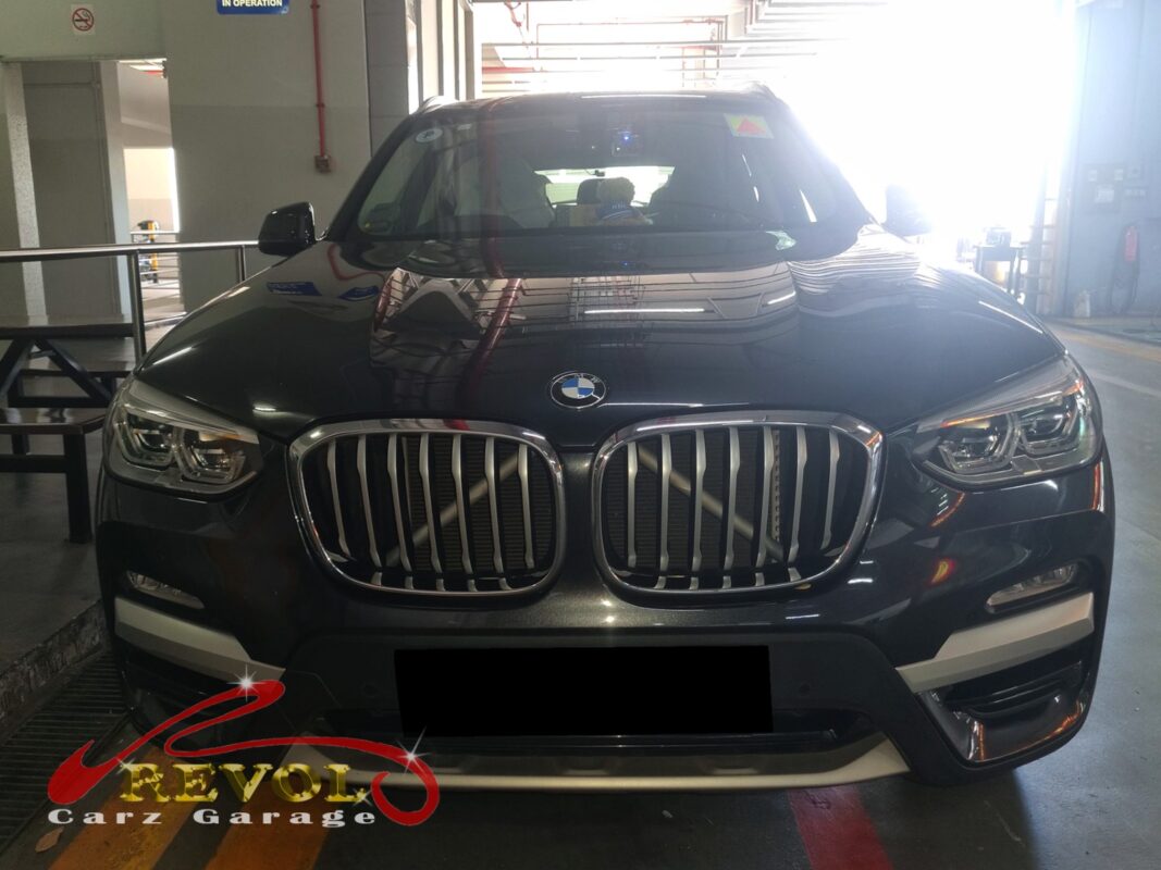 BMW X3 on the workshop lift for routine scheduled servicing.