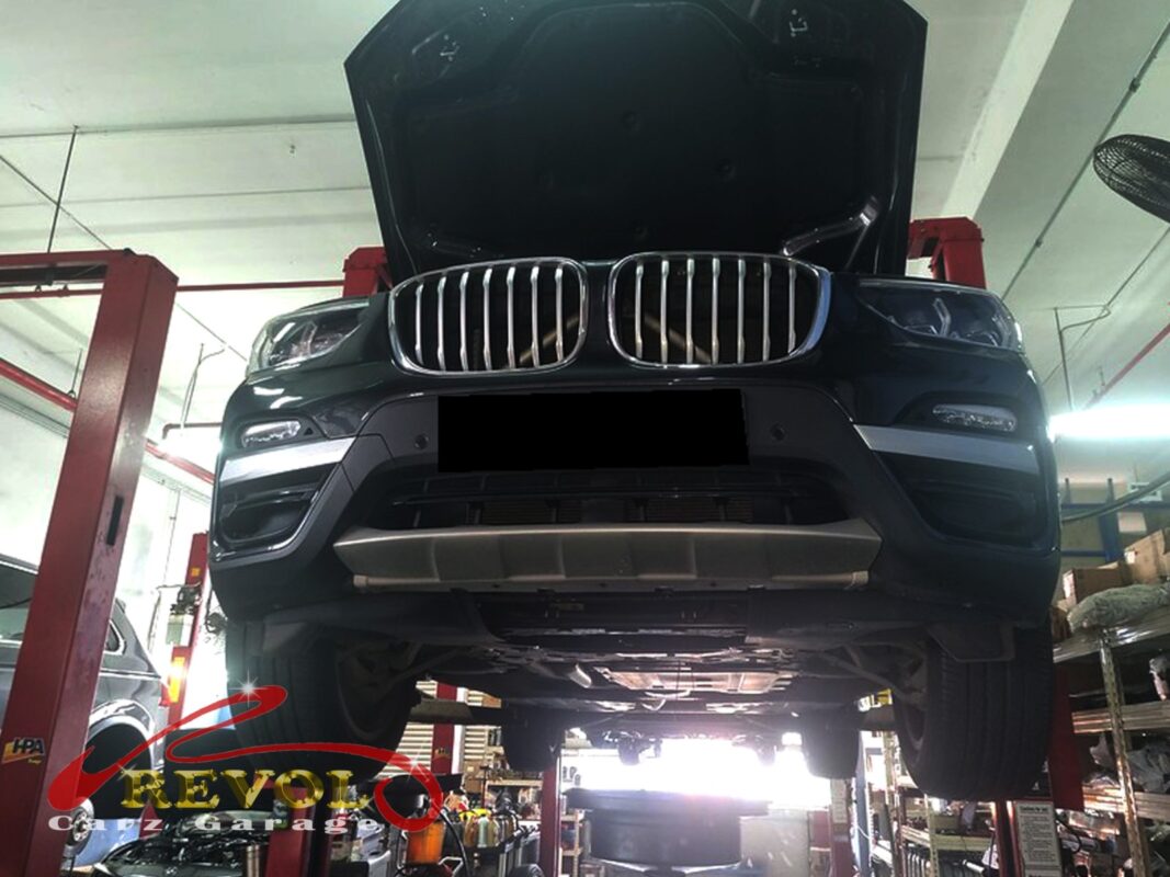 The X3 up on the two-post lift for its scheduled service.