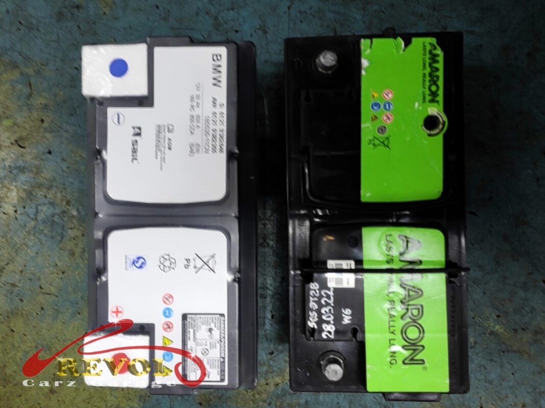 The old Amaron battery (right) replaced with a new BMW-spec AGM battery (left).