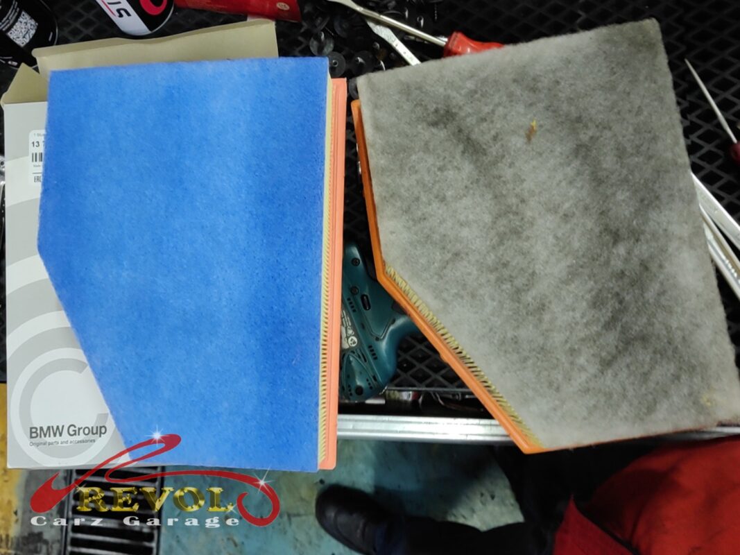 The clogged old engine air filter (right) next to the new BMW-spec replacement (left).