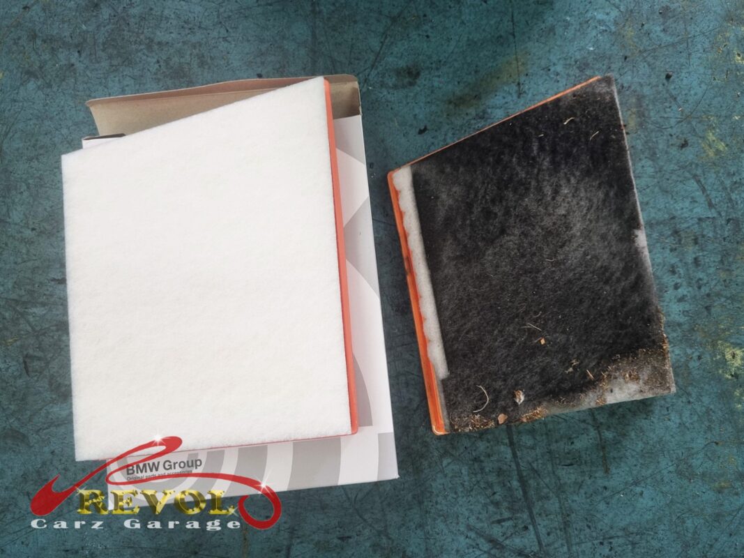 The clogged old engine air filter (right) next to the new BMW-spec replacement (left).