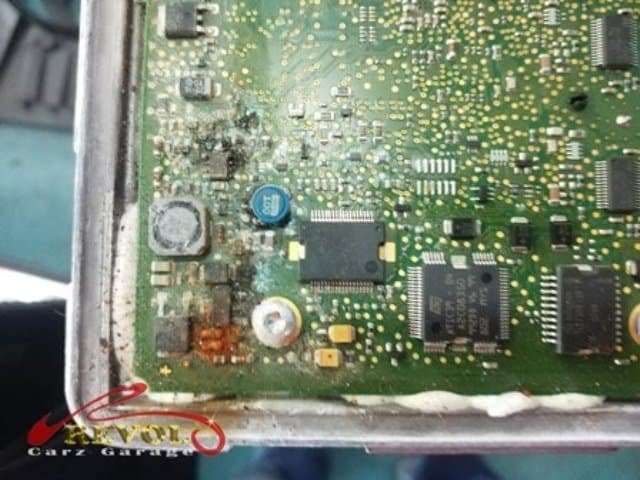 The flooded battery compartment, severely damaged by water.