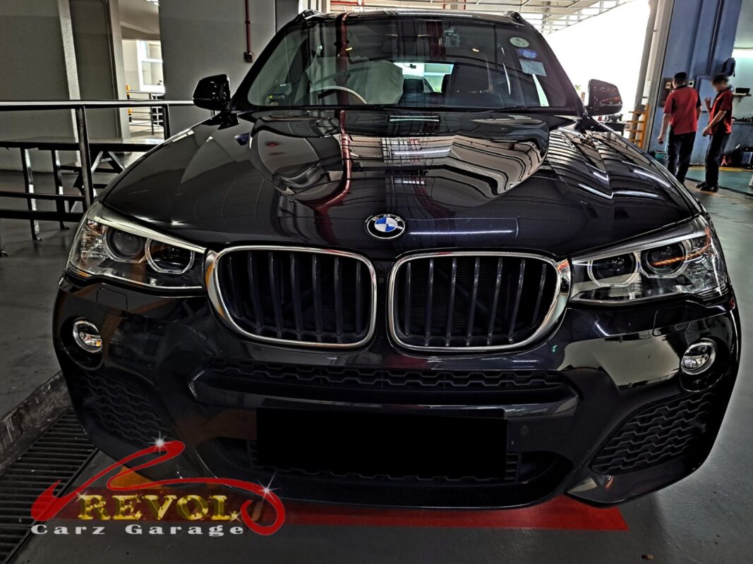 BMW X3 on the workshop lift for full scheduled service.