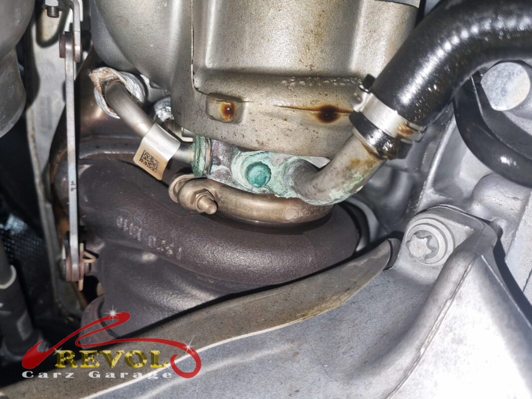 Coolant residue crusted around the turbo coolant line connection, the leak found on the lift.