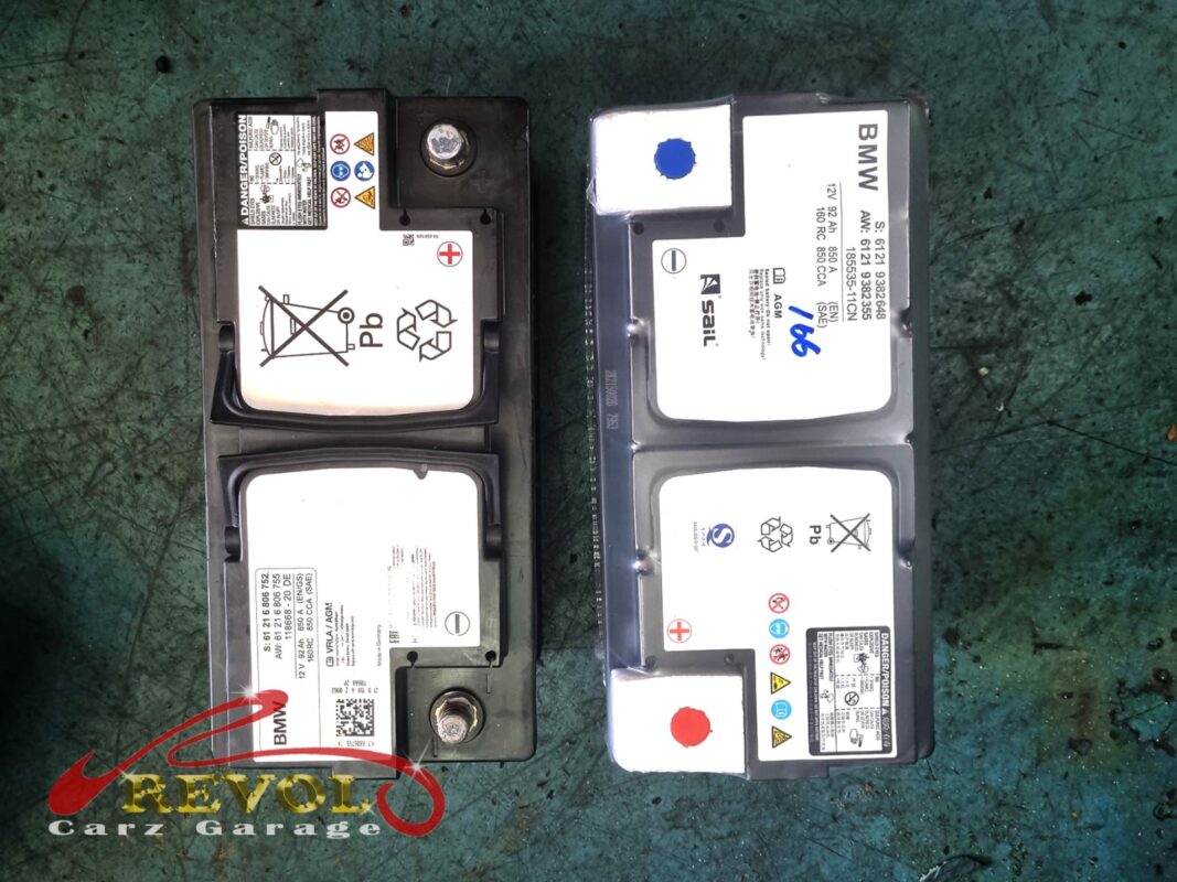 The old BMW battery (left) replaced with a new BMW-spec AGM battery (right).