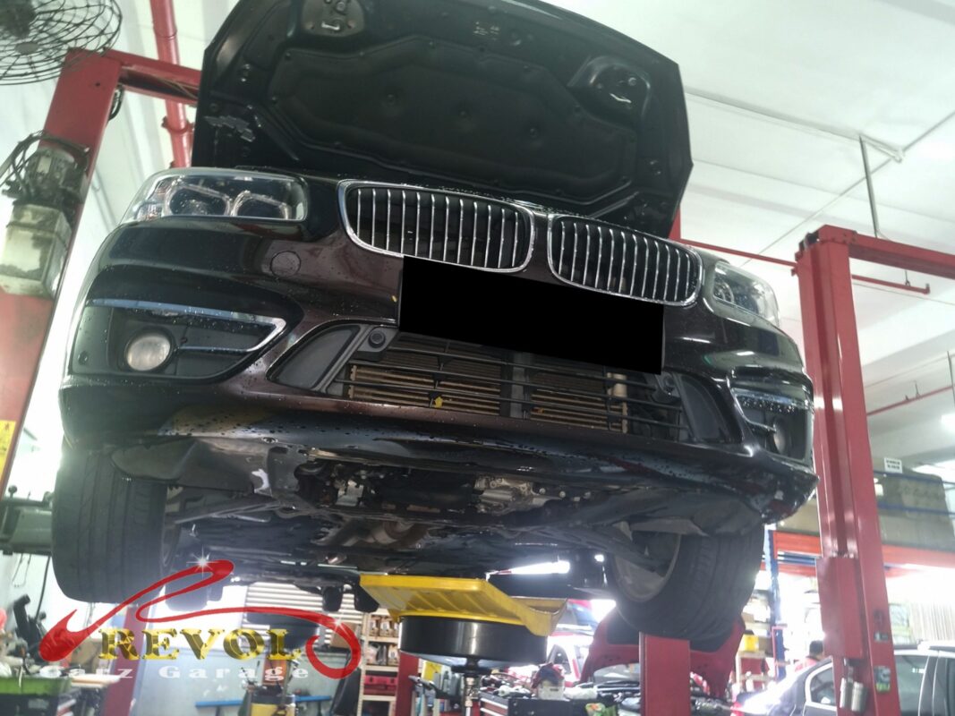 The 216d up on the two-post lift, in for the engine rattle.