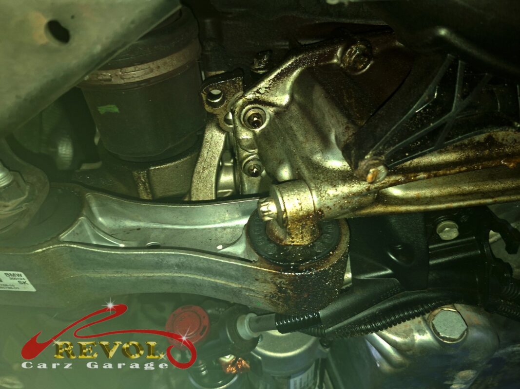 Underneath the 216i, oil baked onto the timing cover area, the source of the slow leak.