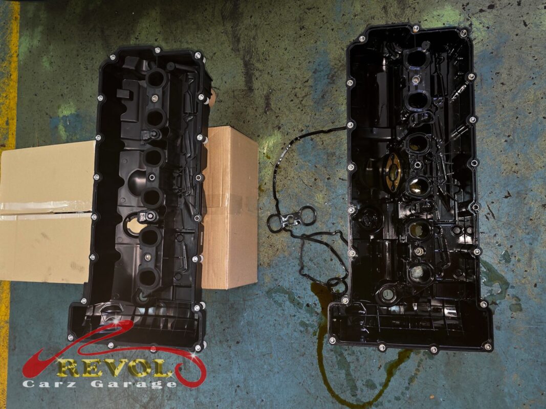 The old valve cover (left) beside the new BMW-spec cover with its integrated gasket (right).