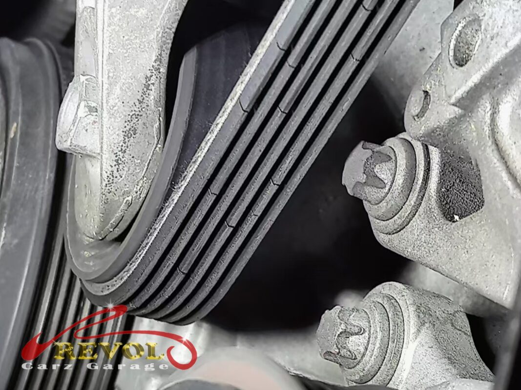 The accessory belt on the engine, due for renewal at this mileage.