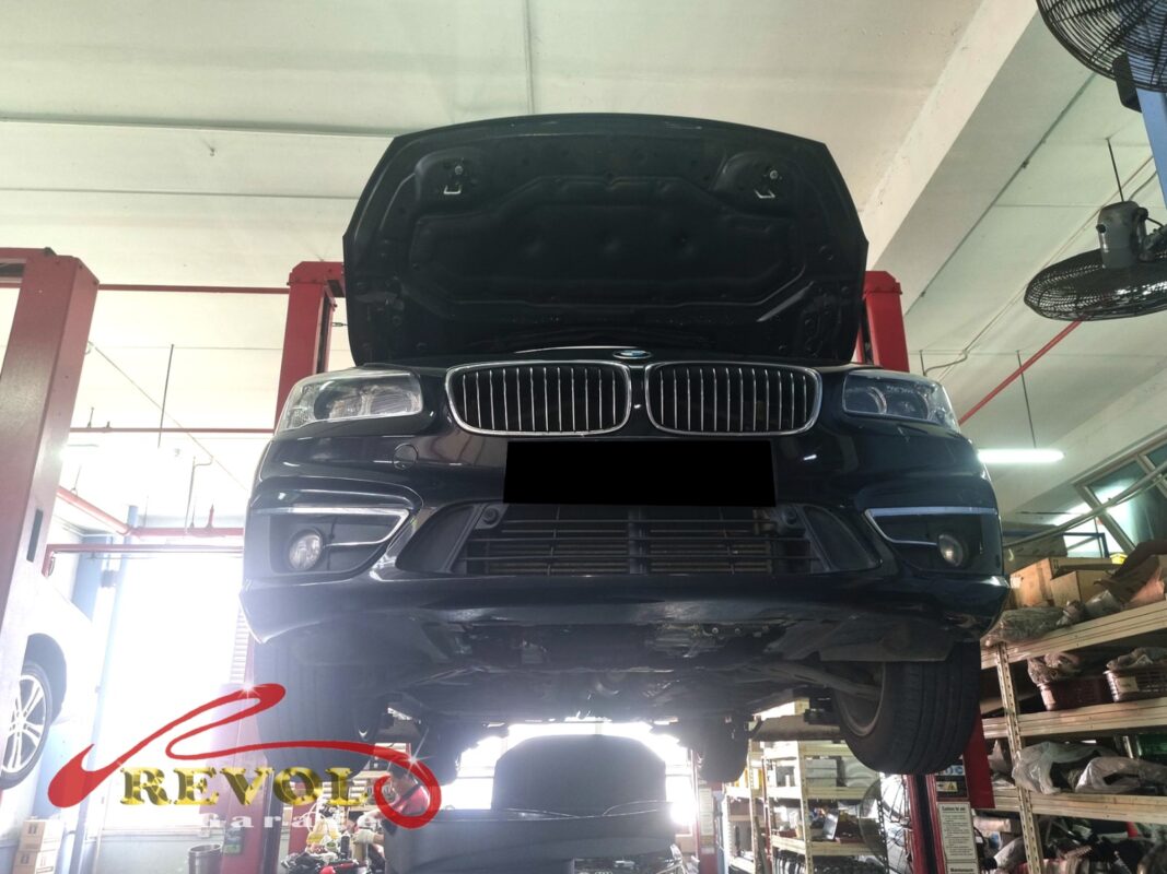 The 216d up on the two-post lift, in for the front lower arms.