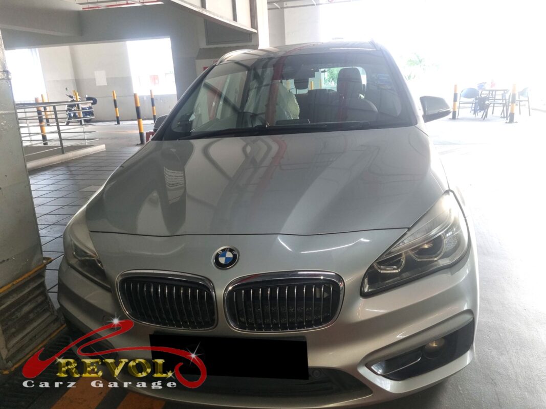 BMW 216d with the engine cover off and intake manifold removed for inspection.