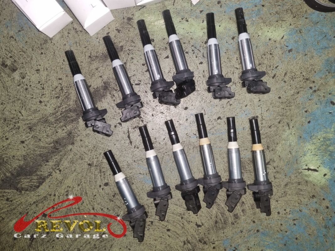 The six old ignition coils (top) beside the new BMW-spec set (bottom).