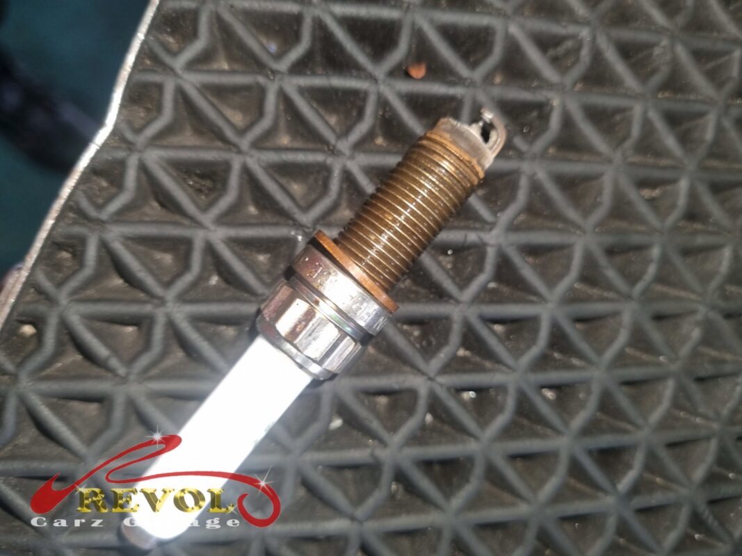 One of the old spark plugs out, the electrode worn, due for renewal.