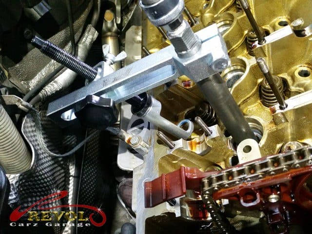 The new and the worn valve stem seal side by side.