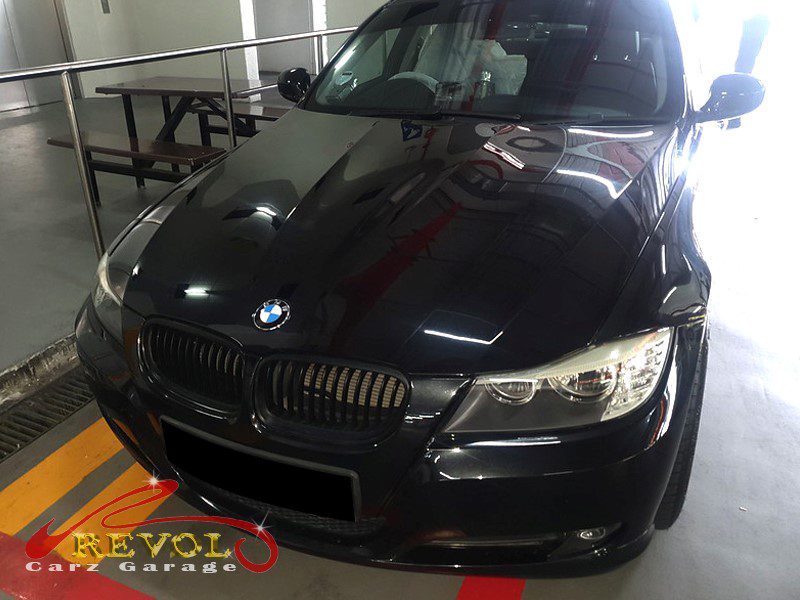 BMW 318i at the workshop, in for a stuck rear door window.