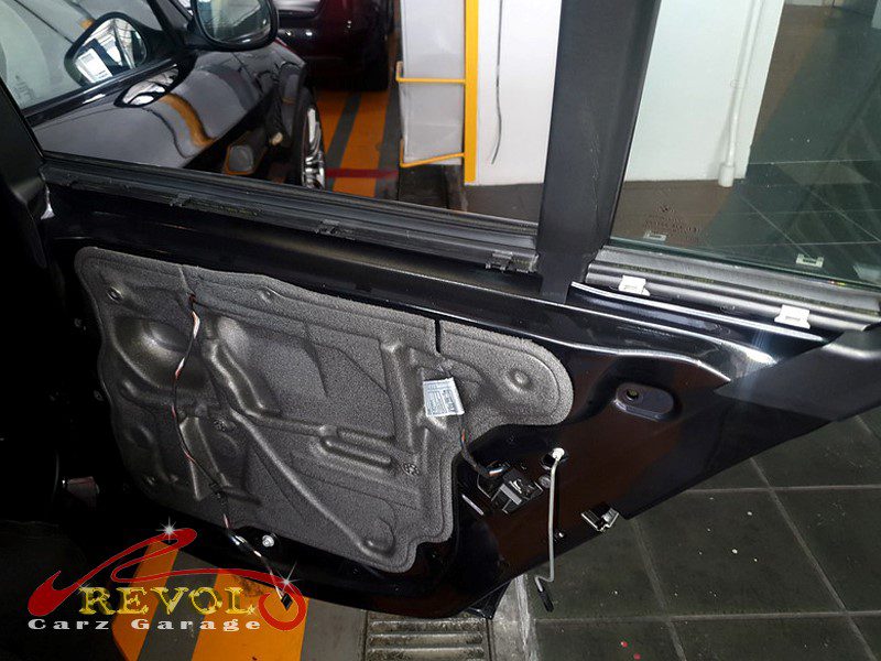 The rear door card removed on the BMW 318i to get at the window mechanism.
