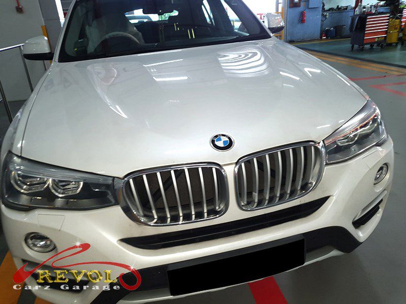 BMW X4 at the workshop, in for a front knocking noise.