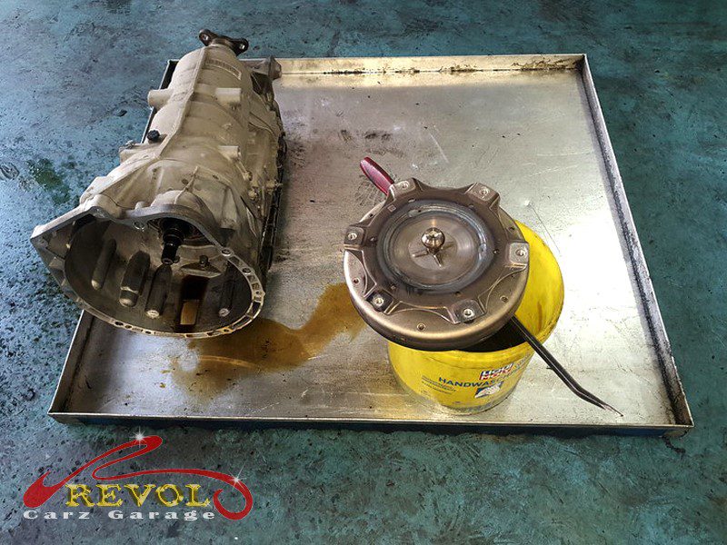 The worn clutch packs and hardened seals inspected.