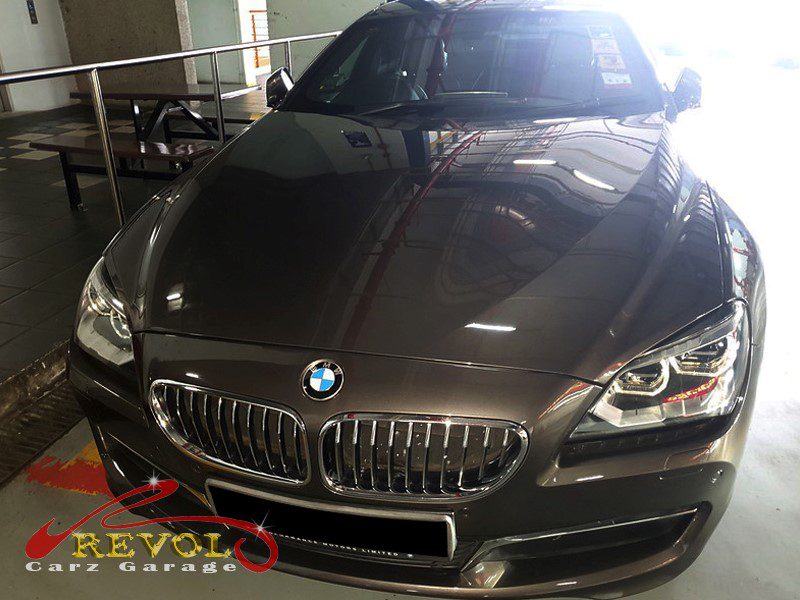 BMW 640i parked at the workshop for a service and battery replacement.