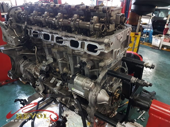 The engine stripped to its components for cleaning and measuring.