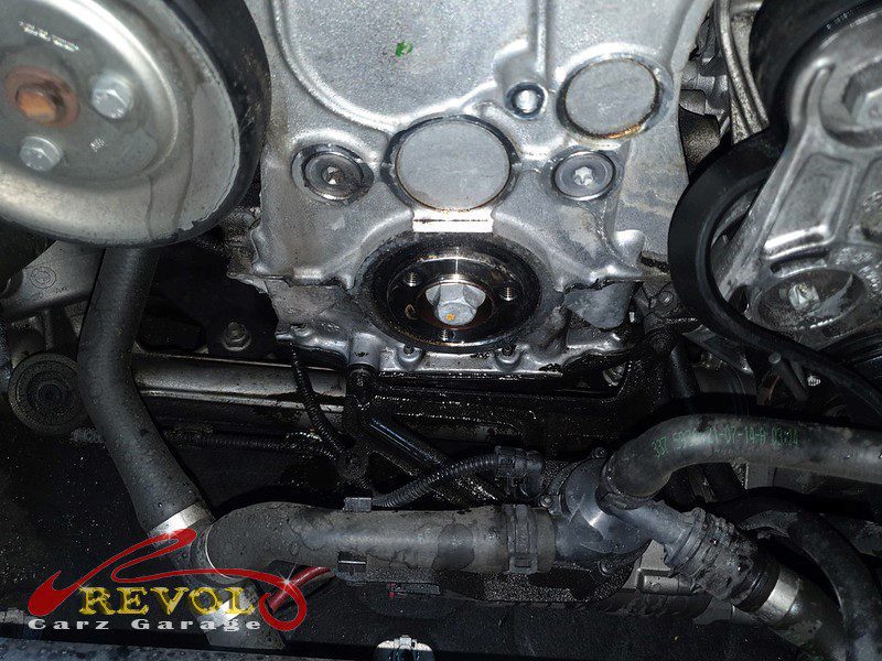The new genuine BMW-spec valve cover with fresh gasket ready to fit.