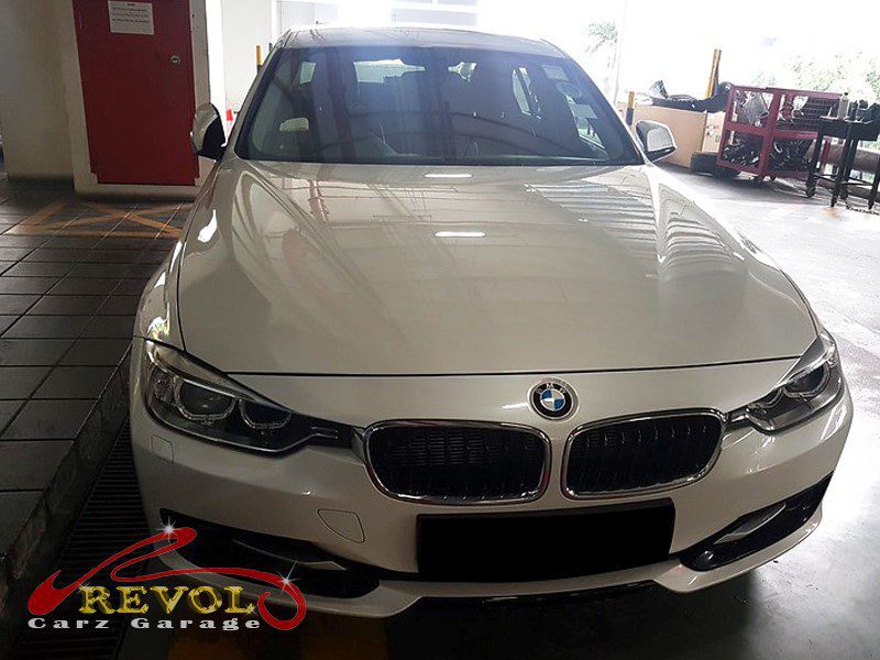 BMW 316i parked at the workshop, in for an engine overhaul.