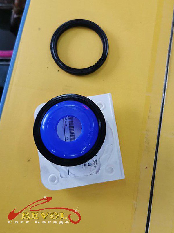 The new genuine BMW-spec oil filter housing gasket ready to fit.