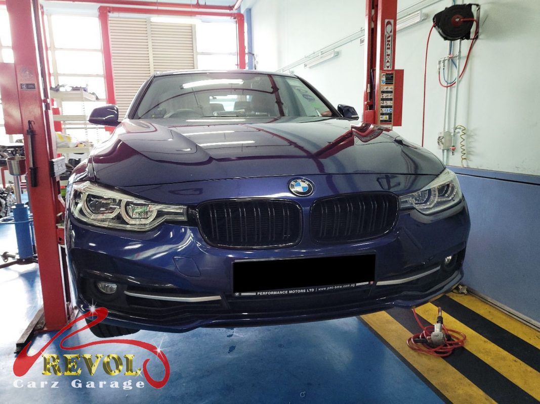 BMW 318i parked at the workshop, in for front brake inspection.