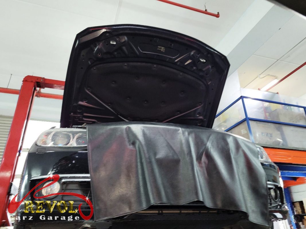BMW 328i parked at the workshop for servicing.