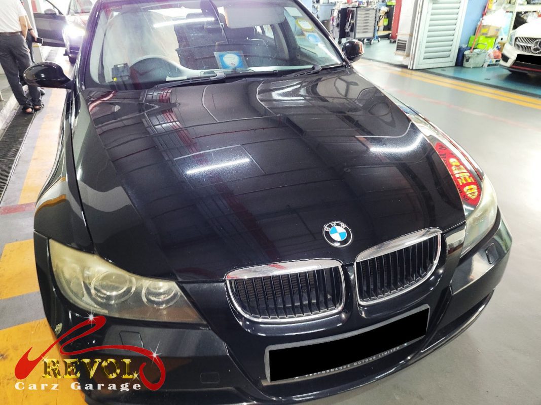 BMW 320i parked at the workshop, in for shock absorber inspection.