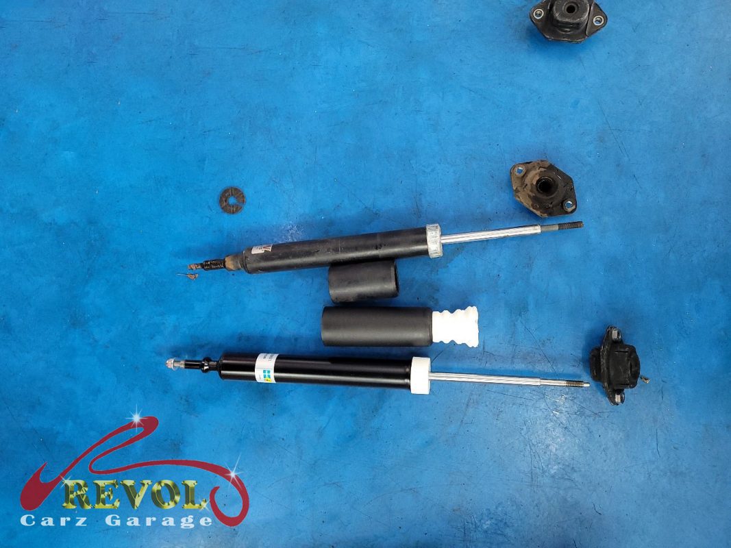 The new genuine BMW-spec front struts and top mounts ready to fit.