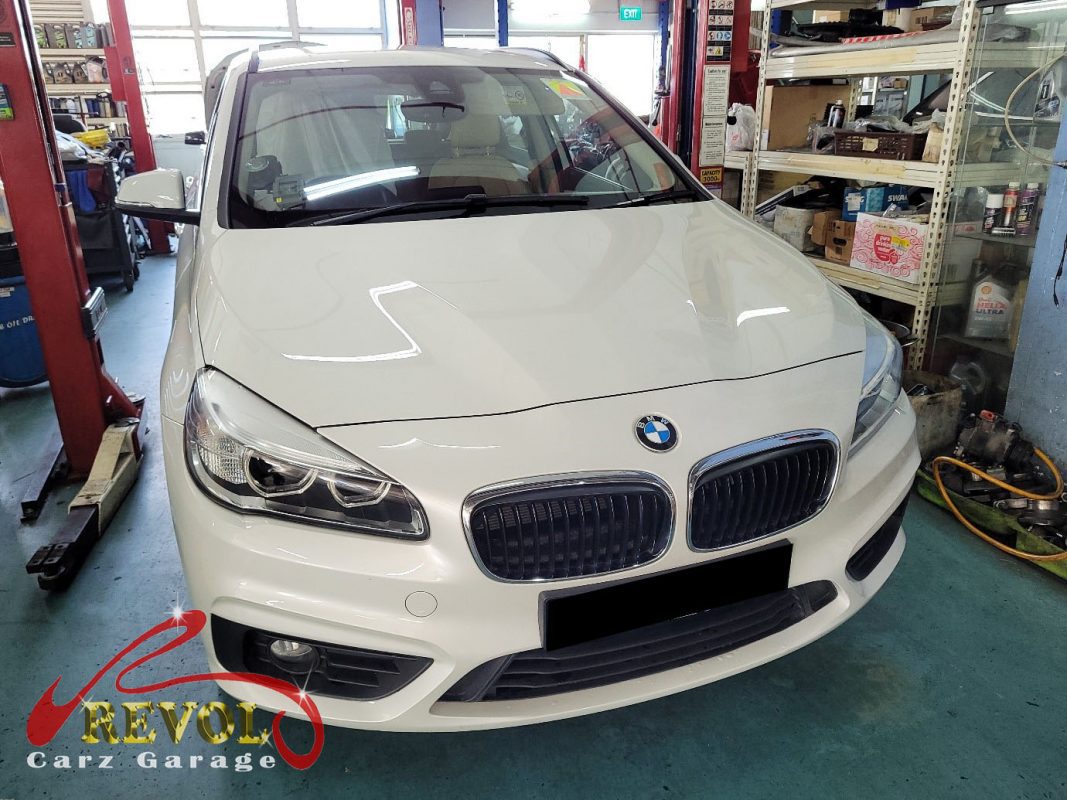 BMW 218i parked at the workshop for servicing.