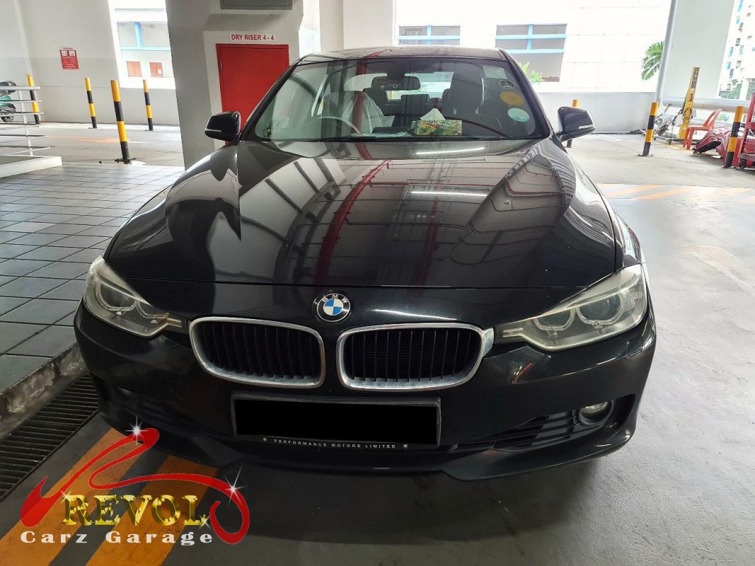 BMW 320i parked at the workshop for servicing.