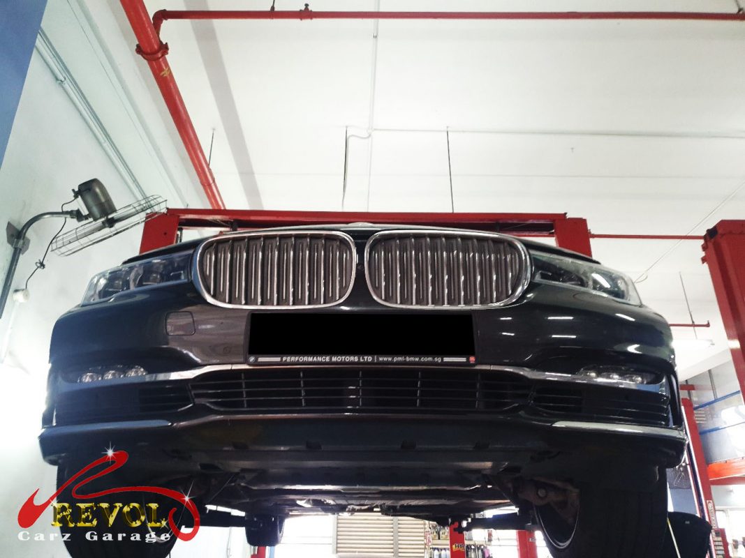 The BMW 730Li sitting low and slanted on one corner, the air suspension fault traced.