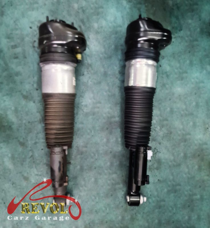 The old perished, leaking air spring removed.