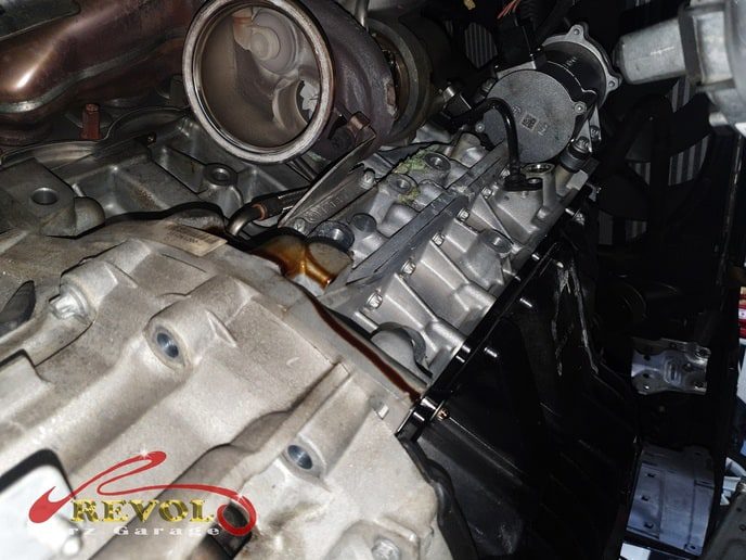 The BMW 520i inspected, the oil leaks traced to the sump gasket and the rear seals.