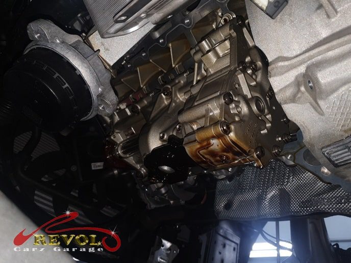 The flywheel and torque converter oil seal leak at the back of the engine.