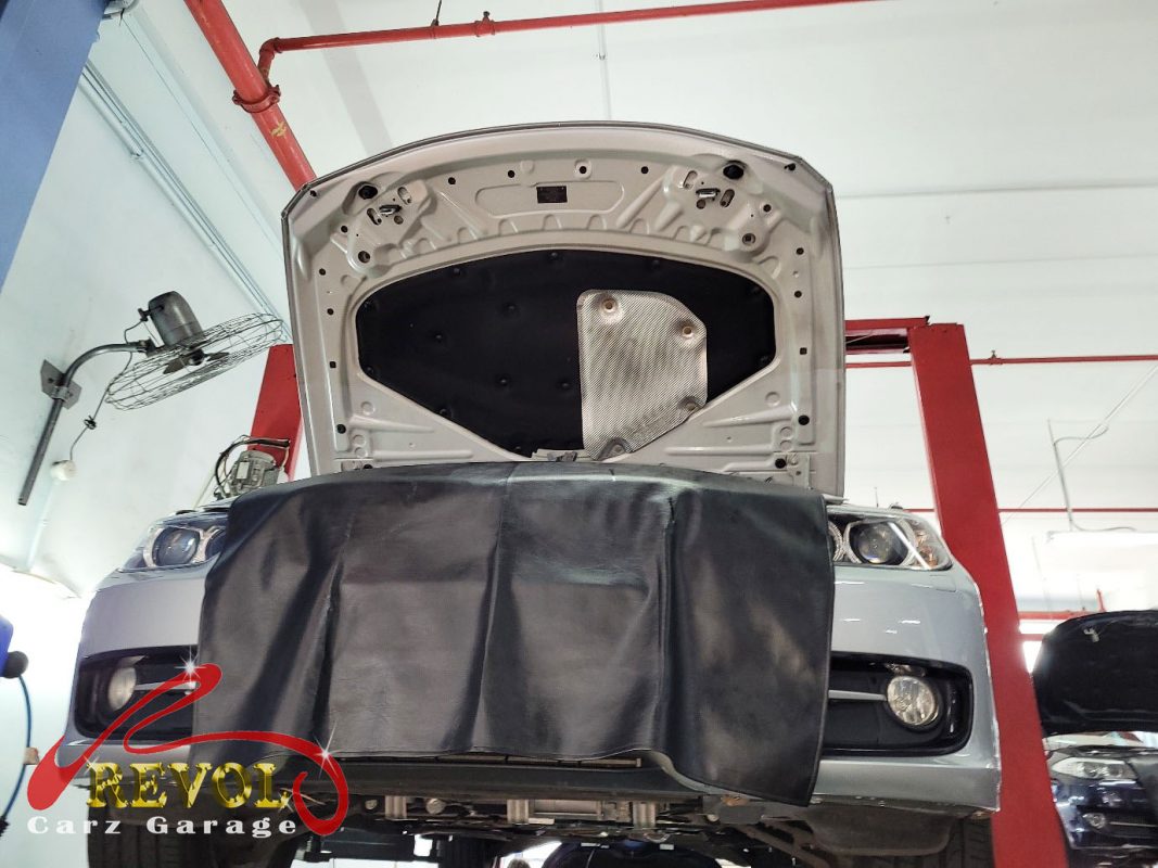 The worn rear pads and scored disc on the BMW 316i, the wear sensor ground through.