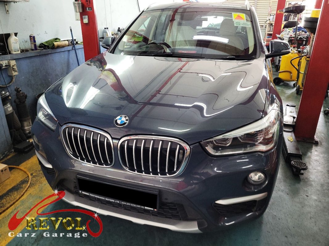 BMW X1 parked at the workshop, in for engine mount inspection.