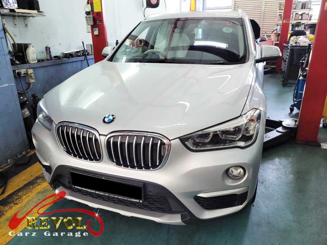 BMW X1 parked at the workshop, in for front brake inspection.