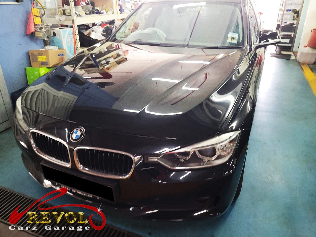 BMW 316i parked at the workshop, in for a squealing drive belt.