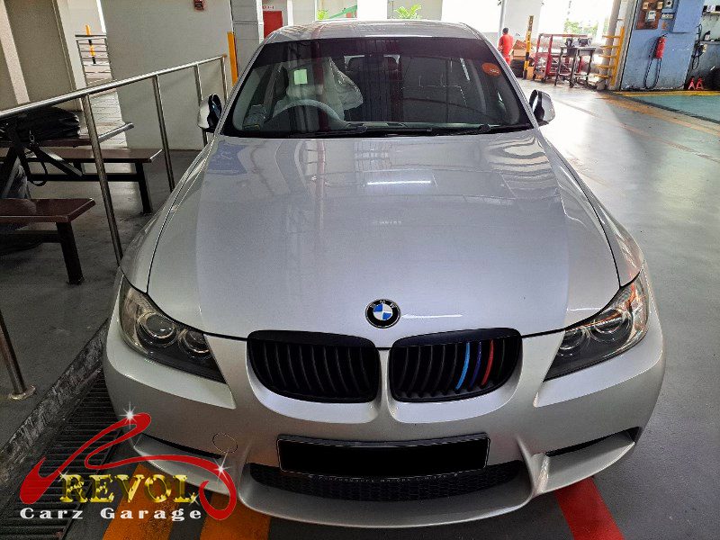 BMW 325i parked at the workshop, in for a rear door lock and window repair.