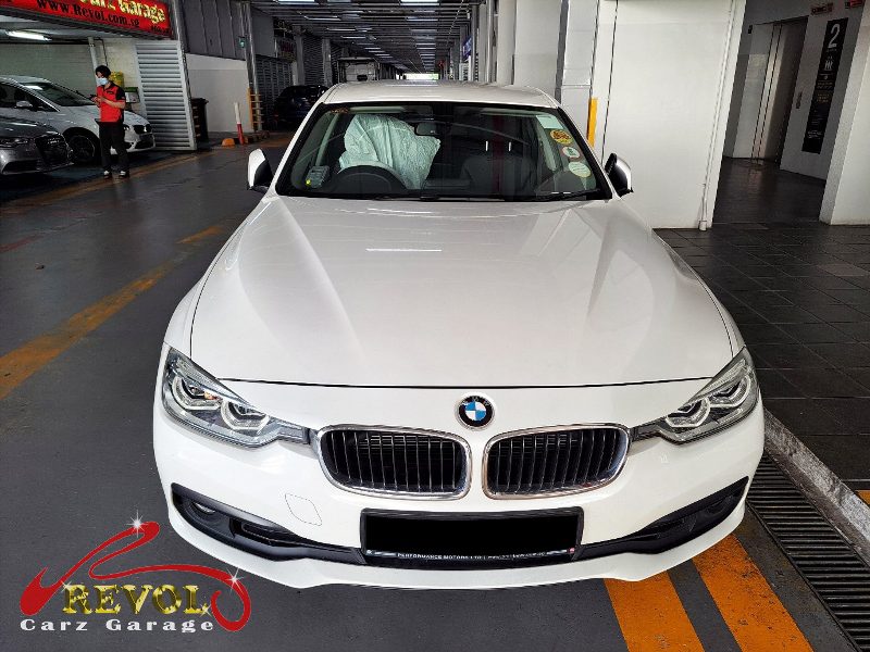 BMW 318i parked at the workshop, in for a coolant leak diagnosis.
