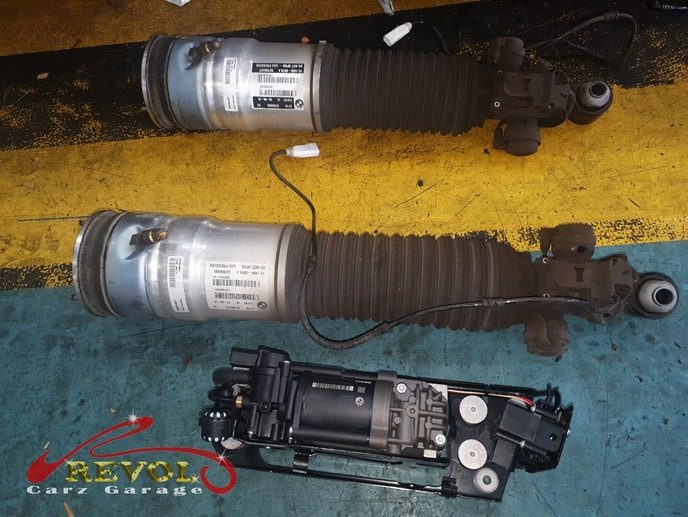 The BMW 750i checked, the rear air strut found leaking and the back sunk.